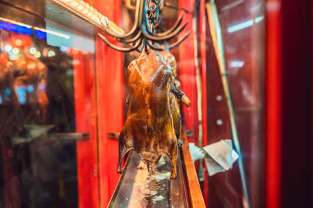 Peking duck is roasting in the oven, preparing to serve on the cost.の写真素材