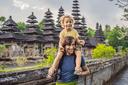 Dad and son tourists in Traditional balinese hindu Temple Taman Ayun in Mengwi.の写真素材