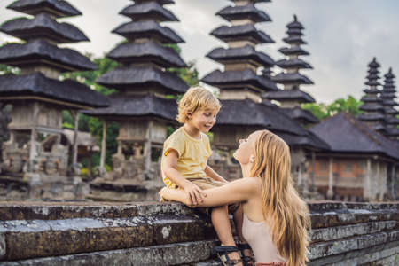 Mom and son tourists in Traditional balinese hindu Temple Taman Ayun in Mengwi.の写真素材