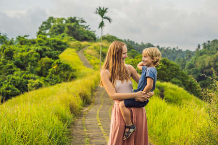 Mom and son tourists in Campuhan Ridge Walk , Scenic Green Valley in Ubud Bali.の写真素材