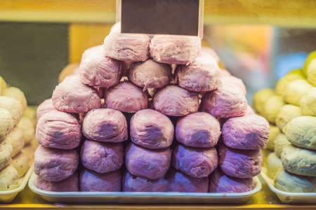 Chinese steamed purple buns with sweet potatoes in the shop window.の写真素材