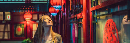 Young woman tourist looks at the Chinese traditional lanterns.の写真素材