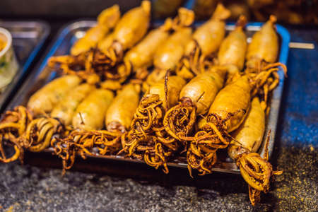 Street foods - Grilled squid Wangfujing night marketの写真素材