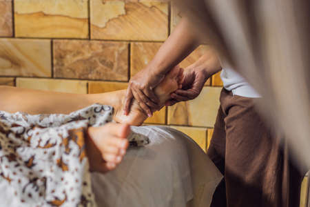 Total relaxation. Beautiful Young Wwoman Get Balinese or Thai Massageの写真素材