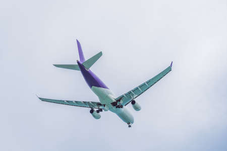 Plane in the sky taking off or landingの写真素材