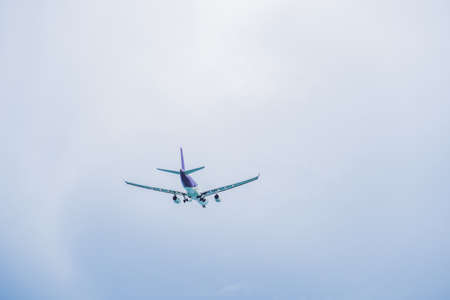 Plane in the sky taking off or landing