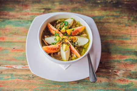 Soto is a traditional Indonesian soup mainly composed of broth, chicken and vegetables
