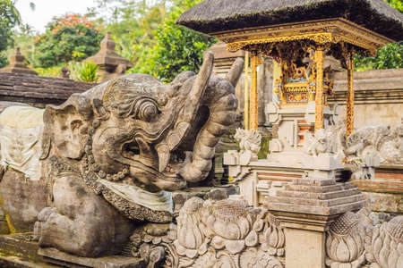 Stone balinese mossy statue Bali island Indonesia