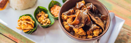 Lifestyle food. A dish consisting of rice, fried fish with wood mushrooms and different kinds of sauces BANNER, long formatの写真素材