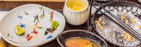 Messy table after meal in Japanese restaurant. Dirty, finish meal, leftovers concepts BANNER, LONG...