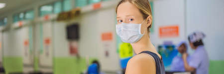 Young woman sitting in hospital waiting for a doctors appointment. Patients In Doctors Waiting Room BANNER, LONG FORMATの写真素材