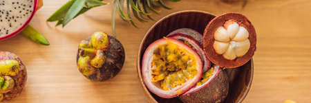 Healthy eating background of different fruits on old wooden table BANNER, LONG FORMAT