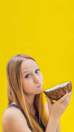 Young woman doing oil pulling over yellow background VERTICAL FORMAT for mobile story or stories...