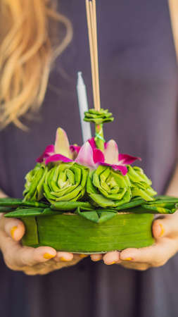 Loy Krathong festival, People buy flowers and candle to light and float on water to celebrate the Loy Krathong festival in Thailand VERTICAL FORMAT for mobile story or stories size.の写真素材