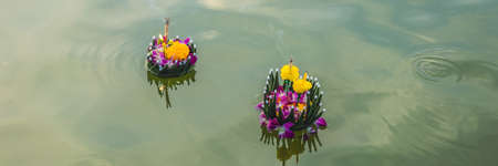 Loy Krathong festival, People buy flowers and candle to light and float on water to celebrate the Loy Krathong festival in Thailand BANNER, LONG FORMATの写真素材
