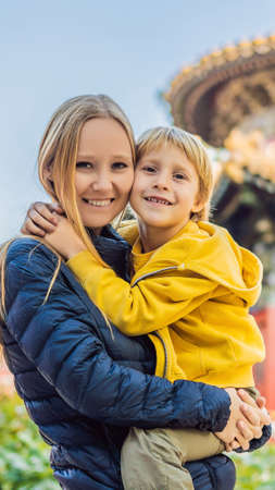Enjoying vacation in China. Mom and son in Forbidden City. Travel to China with kids concept. Visa free transit 72 hours, 144 hours in China VERTICAL FORMAT mobile story or stories size. Mobile wallpaperの写真素材