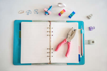 Notepad and stationery on white background. Planner for business and study. Fans of stationery