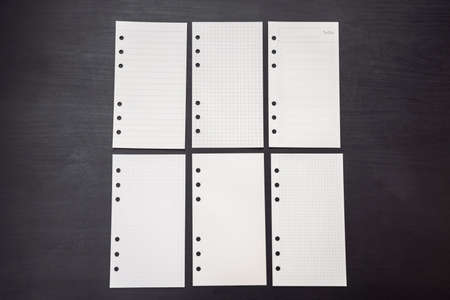 Different paper for notepad mocap on a black wooden background