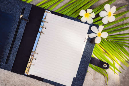 Notepad and stationery on wooden background. Planner for business and study. Fans of stationery....