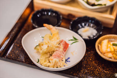 Bento set of prawn tempura and chicken teriyaki in japanese restaurantの写真素材