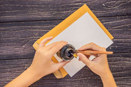 Womens hands in a wooden  holding a signboard, drawing block, paper, mockupの写真素材
