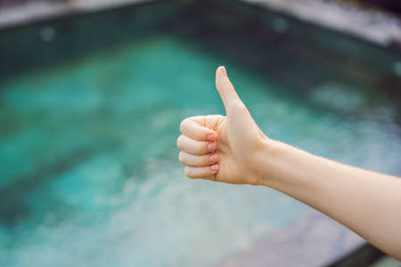 Hand shows like. Pool quality, pool cleaningの写真素材