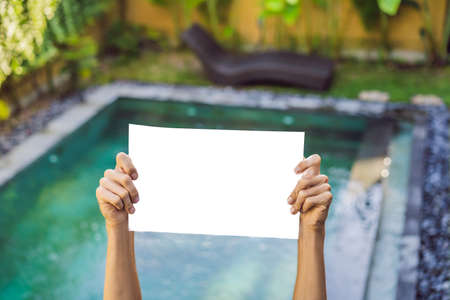 Paper on the background of the pool, copy space