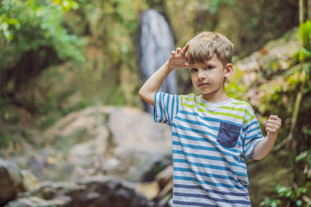 Children rest during a hike in the woodsの写真素材