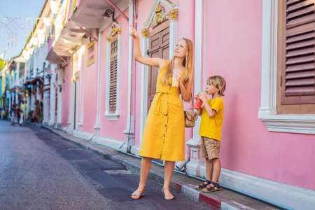 Mom and son tourists on the Street in the Portugese style Romani in Phuket Town. Also called Chinatown or the old town. Traveling with kids conceptの写真素材