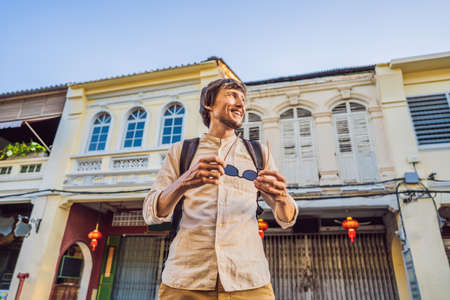 Man tourist on the Street in the Portugese style Romani in Phuket Town. Also called Chinatown or the old townの写真素材