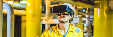 BANNER, LONG FORMAT Young woman in a yellow work uniform, glasses and helmet uses virtual reality...