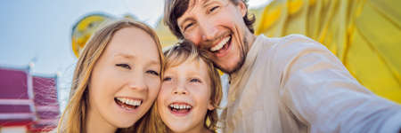 Happy tourists mother, father and son on background ofLying Buddha statue BANNER, LONG FORMATの写真素材