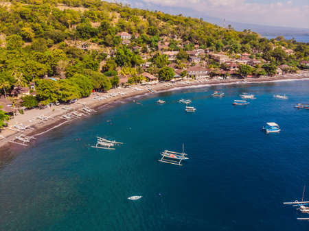 Jemeluk Bay, Amed. Amed is fast becoming a popular tourist destination in Bali, Indonesia. Set in the North-East of Bali, it is a home to excellent snorkeling, scuba diving, freediving and yogaの写真素材