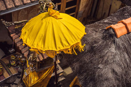 Typical Balinese umbrellas placed in the home temple Ubud, Bali - Indonesiaの写真素材