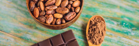 Chocolate and cocoa beans on color wooden background BANNER, LONG FORMATの写真素材