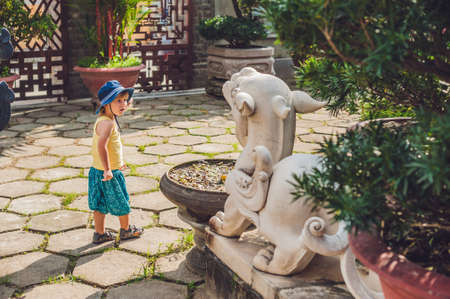 Boy tourist in Buddhist temple in Vietnam Nha Trangの写真素材