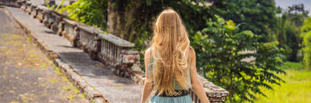 Woman tourist in abandoned and mysterious hotel in Bedugul.の写真素材