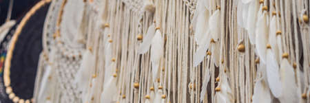 BANNER, LONG FORMAT Typical souvenir shop selling souvenirs and handicrafts of Bali at the famous Ubud Market, Indonesia. Balinese market. Souvenirs of wood and crafts of local residentsの写真素材