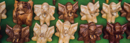 BANNER, LONG FORMAT Typical souvenir shop selling souvenirs and handicrafts of Bali at the famous Ubud Market, Indonesia. Balinese market. Souvenirs of wood and crafts of local residentsの写真素材