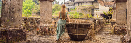 Woman tourist in abandoned and mysterious hotel in Bedugul.の写真素材