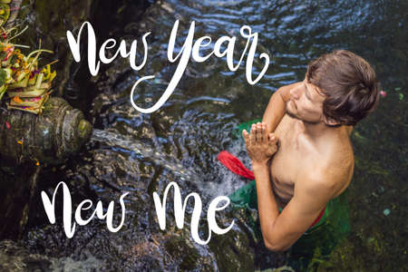 NEW YEAR NEW ME concept Man in holy spring water temple in bali. The temple compound consists of a petirtaan or bathing structure, famous for its holy spring waterの写真素材