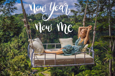 NEW YEAR NEW ME concept Young woman swinging in the jungle rainforest of Bali island, Indonesia....