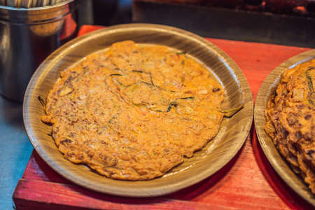 Typical Korean street food on a walking street of Seoul. Spicy fast food simply found at local...