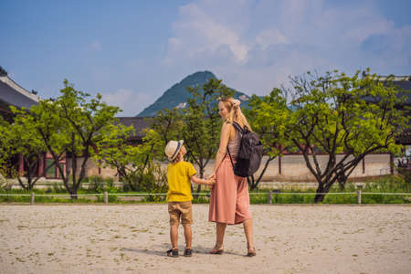 Mom and son tourists in Korea. Korean palace in Seoul, South Korea. Travel to Korea concept. Traveling with children conceptの写真素材