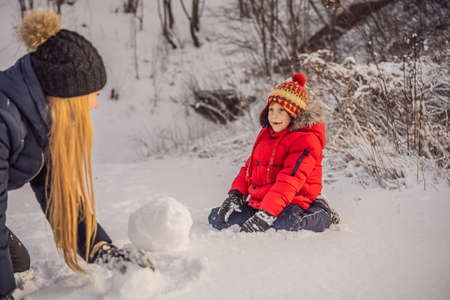 Happy family in warm clothing.の写真素材