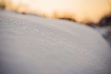 Pure white pristine snow. Texture of white snow with shadowsの写真素材