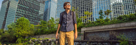 Young man tourist in Cheonggyecheon stream in Seoul, Korea.