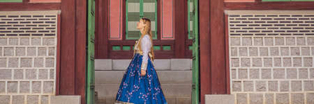 Young caucasian female tourist in hanbok national korean dress Travel to Korea concept.