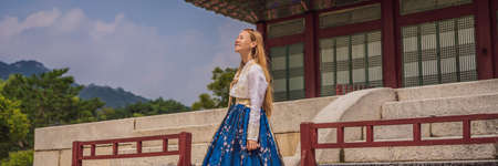 Young caucasian female tourist in hanbok national korean dress.の写真素材