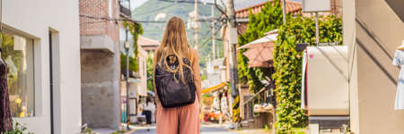 Young woman tourist in Bukchon Hanok Village is one of the famous place for Korean traditional houses have been preserved.の写真素材